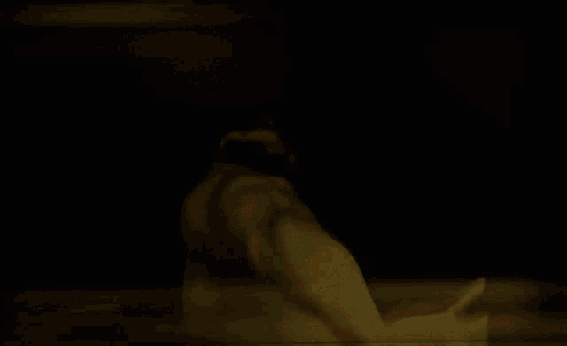 a blurred image of a person 's feet with a yellow background