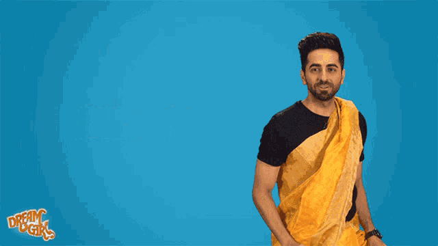 a man in a yellow saree is standing in front of a blue background with the words all set