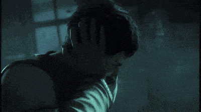 a ghost with a skull painted on his face is glowing in the dark