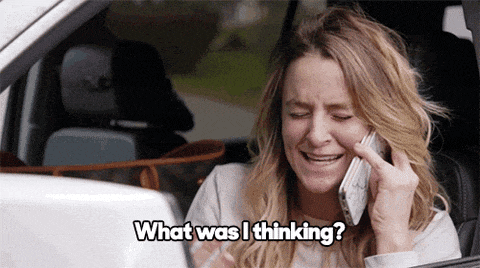 a woman is crying while talking on a cell phone and the words what was i thinking are visible