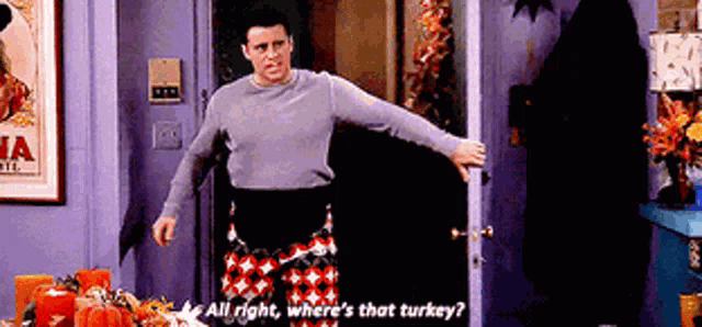 a man is standing in front of a door asking where 's that turkey '