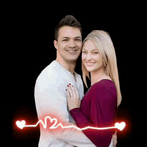 a man and a woman are posing for a picture with a heartbeat line between them .