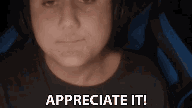 a man wearing headphones says appreciate it in front of his face