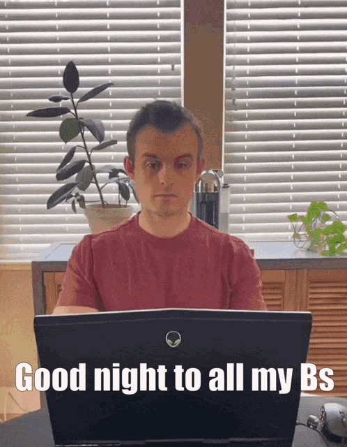 a man sitting in front of a laptop with the words good night to all my bs written on the screen