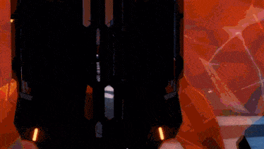 a close up of a futuristic object with orange lights on the side