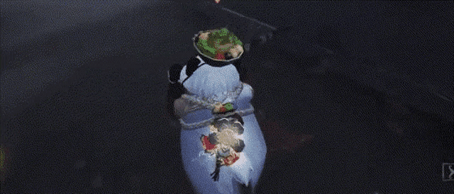 a snowman with a bowl of food on its head is tied to a rope .