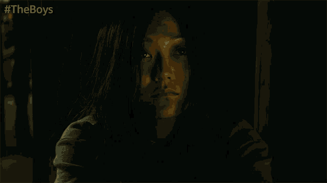 a close up of a woman 's face with the words #theboys above her
