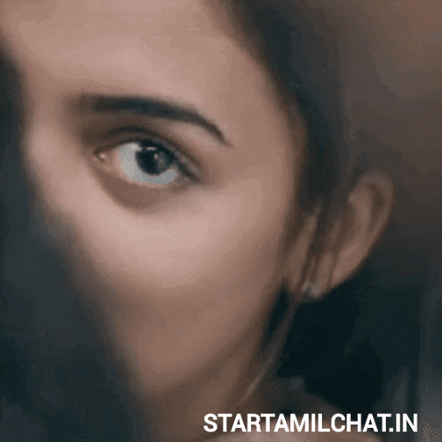 a close up of a woman 's face with the words starttamilchat.in written below it