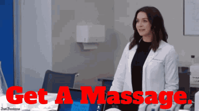 a woman in a lab coat is standing in front of a desk with the words get a massage written on it