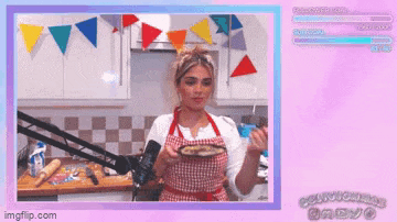 a woman in an apron holds a plate of food in front of a microphone ..