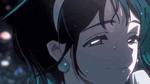 a close up of a girl 's face with tears running down her cheeks .