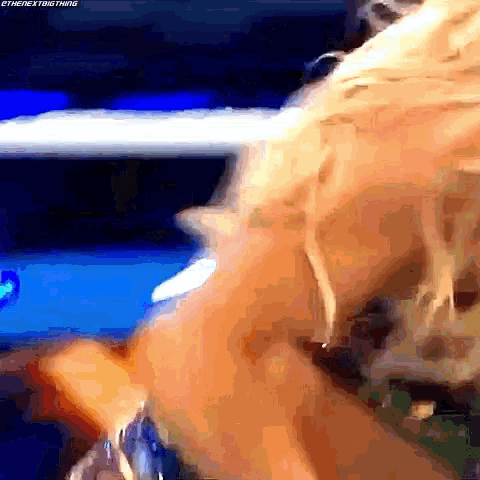 a close up of a person 's face in a wrestling ring
