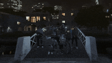 a group of people standing on a bridge at night with guns