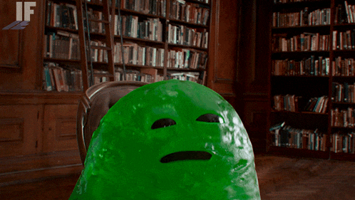a green jelly monster in a library with if written on the bottom right