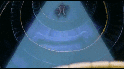 a person is flying through a tunnel with a blue light behind them