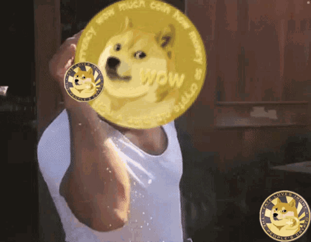 a man is holding a doge coin in front of his face