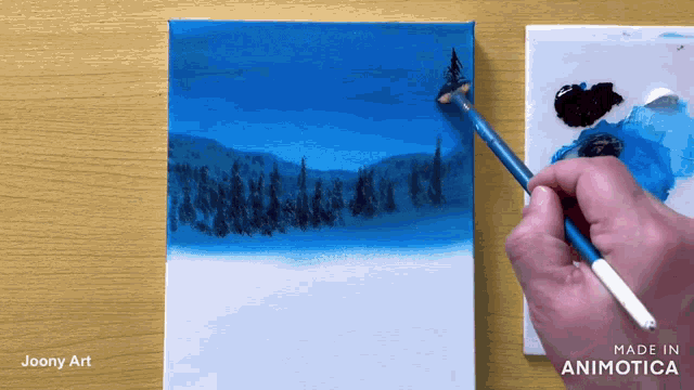 a person is painting a landscape with a brush on a canvas made in animatica