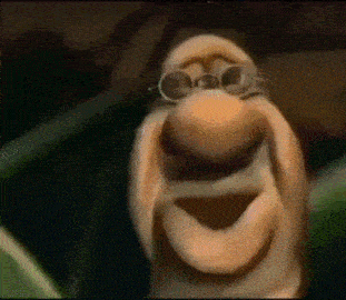 a close up of a cartoon character wearing glasses and making a face .