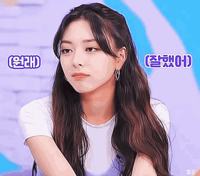 a girl with long hair is wearing a white shirt