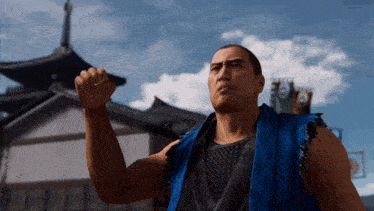a man wearing a blue vest is standing in front of a building