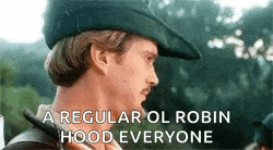robin hood is wearing a green hat and a mustache and says a regular ol robin hood everyone .