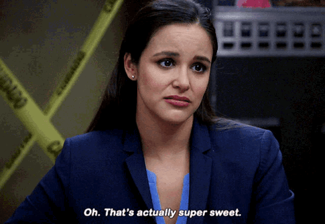a woman in a blue suit is saying oh that 's actually super sweet
