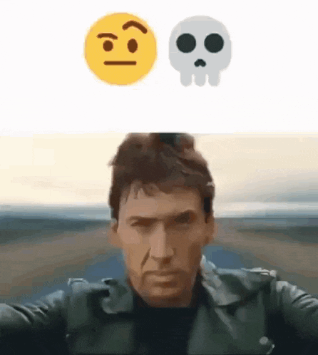 a man in a leather jacket is taking a selfie next to a skull and smiley face .