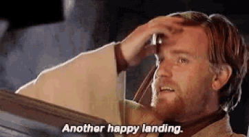 a man with a beard is holding his hand to his head and says another happy landing