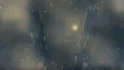 a blurred image of a person standing in a dark room with a light coming out of the ceiling .