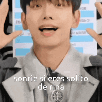 a close up of a man 's face with the words sonrie si eres solito de rina written below him