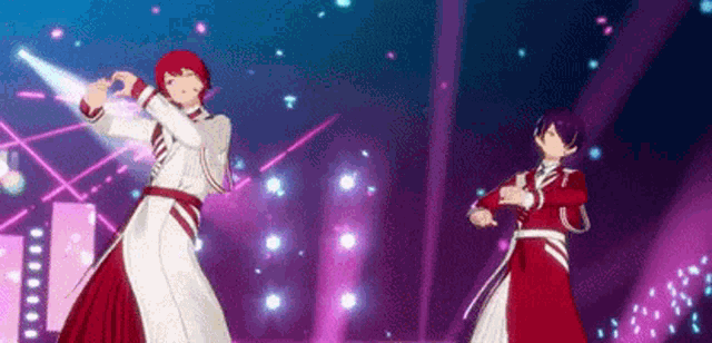a couple of anime characters are dancing on a stage in a video game .