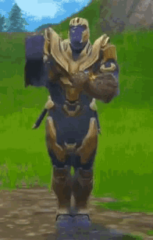 thanos is dancing in a video game while holding a glove in his hand .