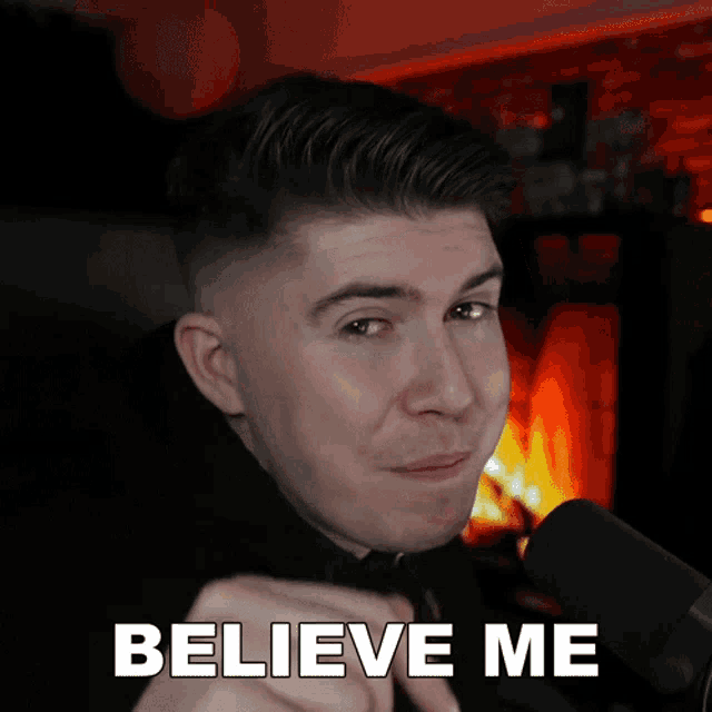 a man in front of a fireplace with the words believe me above him
