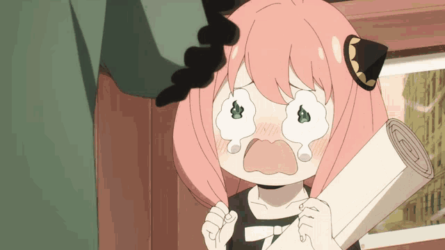 a girl with pink hair is crying and holding a scroll
