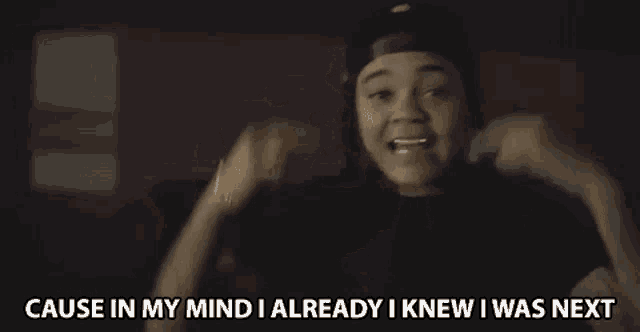 a man is covering his ears with his hands and says cause in my mind i already i knew i was next