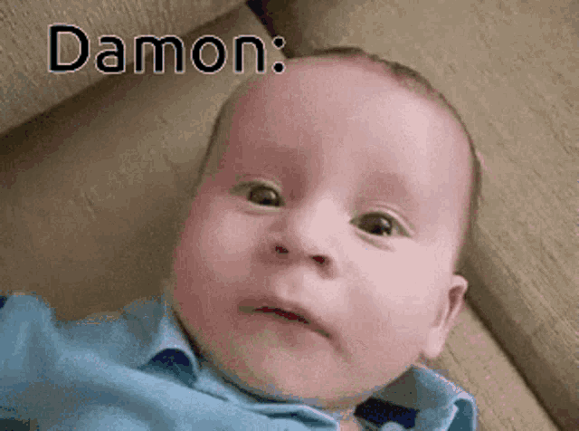 a baby is laying on a couch with the name damon written above him