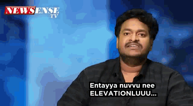 a man in a black shirt is talking on a newssense tv show