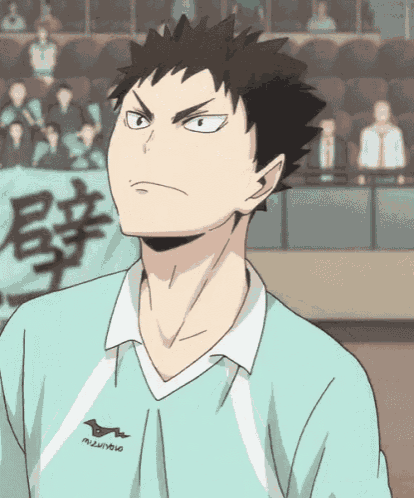 a man wearing a mizuno shirt is looking at something