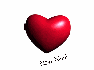 two heart shaped buttons with the words now kiss written below them