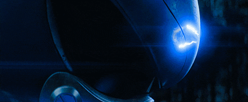 a close up of a blue object with a lightning bolt on it