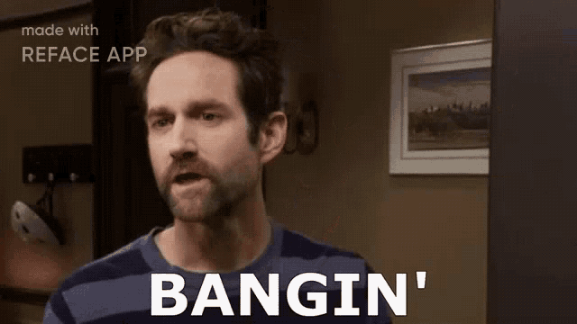 a man in a striped shirt is standing in a room with the words bangin ' on his face .