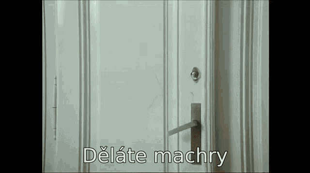 a close up of a door with the words delate machry below it