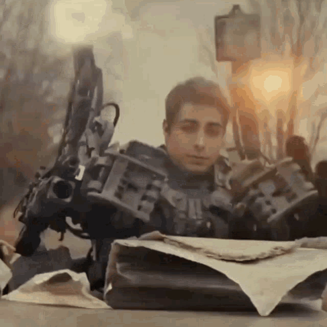 a man in a robotic suit is holding a briefcase