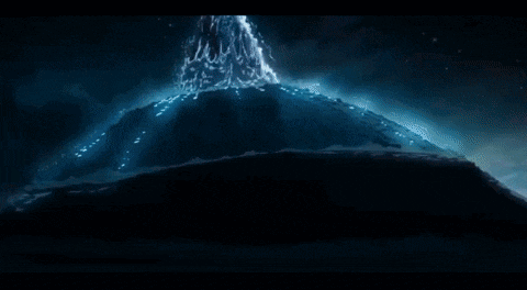 a waterfall is coming out of a mountain