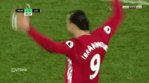 a soccer player wearing a red jersey with the number 9 on the back