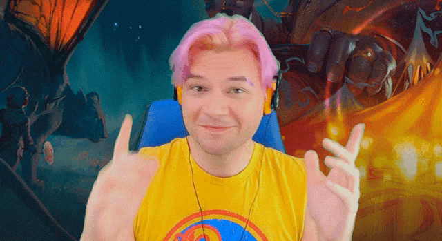 a man with pink hair is wearing headphones and a yellow shirt