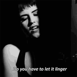 a black and white photo of a woman singing with the words do you have to let it linger above her