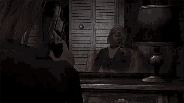 a woman is talking to a man in a video game while sitting at a table with a lamp .