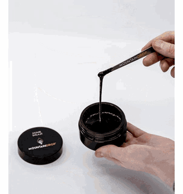 a person is holding a spoon that says mountaindrop