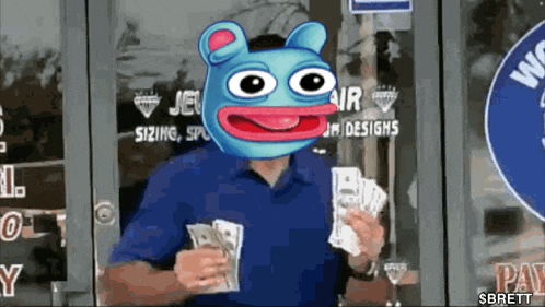 a man in a blue shirt with a frog head holding money